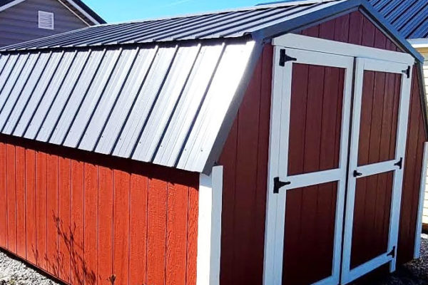 exterior of amazing red and white low barn painted wood shed for sale in KY and TN