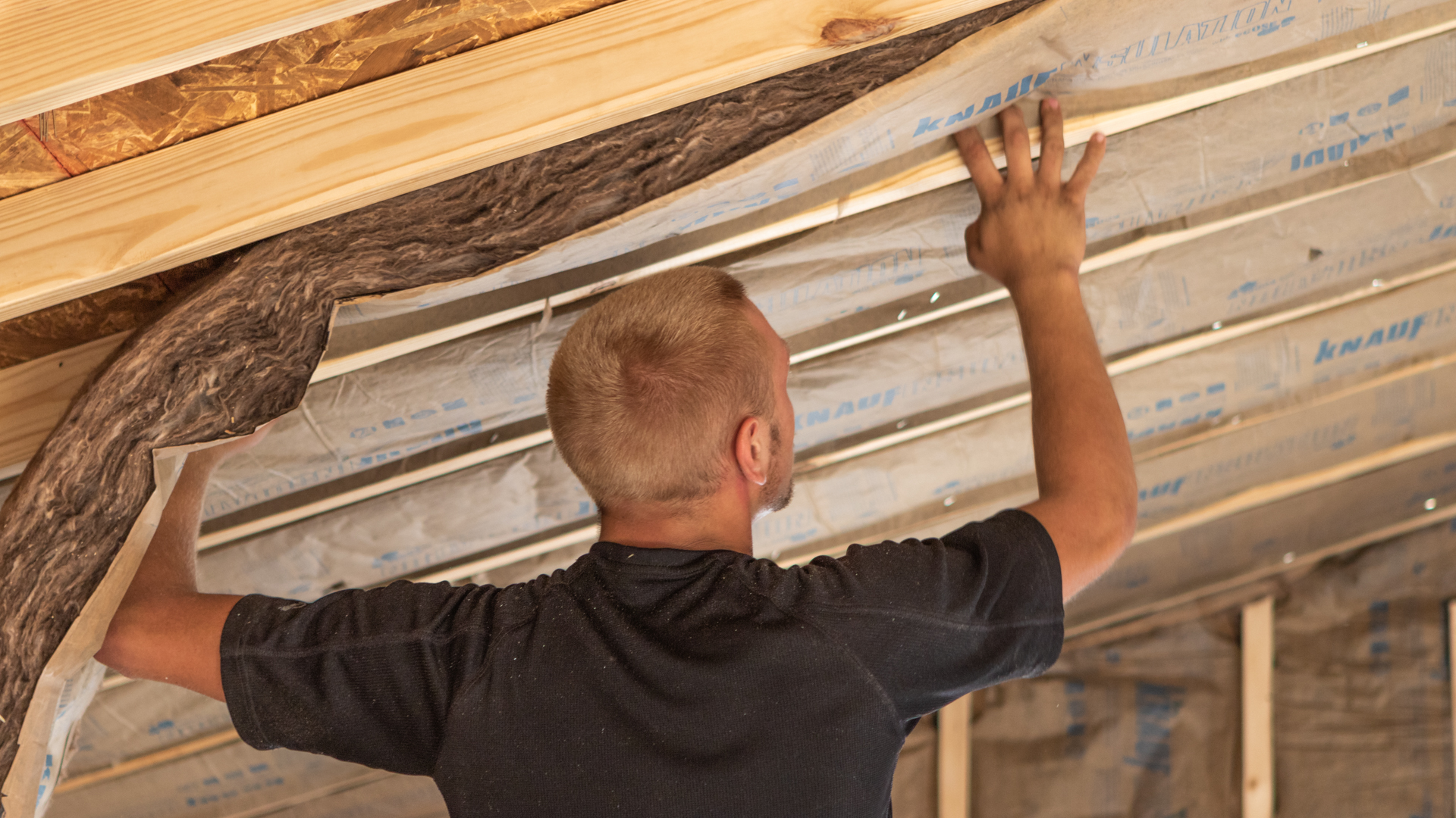 man building a custom shed